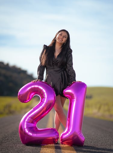 birthday girl posing for her birthday photo portraits taken by a professional photographer