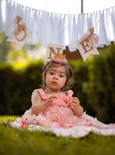 little girl posing in front of the camera to get her picture taken by a photographer in visalia