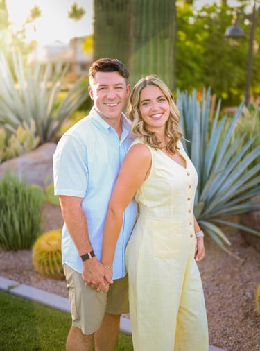 Couple smiling together during a golden hour portrait session in Arizona.