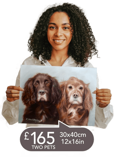 A woman holding a oil painting of 2 dogs portrait size 45cm x 30cm only £165