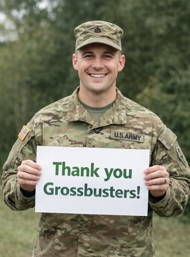 a soldier in uniform holding a sign that says Thank you Grossbusters!
