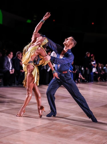 a dance couple posing at the competition