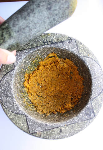marinade paste in mortar and pestle for Thai chicken satays