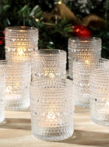 Set of clear ribbed drinking glasses arranged on a dining table in natural light.
