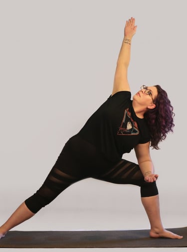 rachel in yoga pose, black outfit purple hair white background