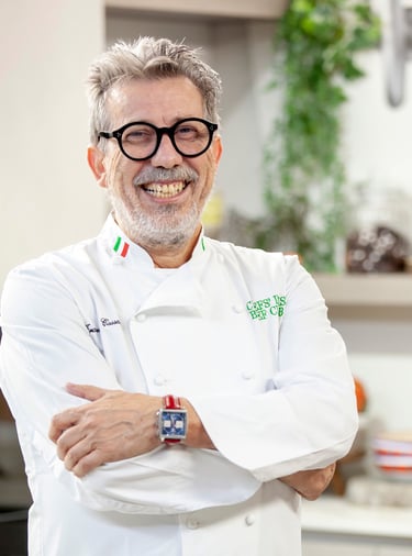 a man in a white shirt and glasses is smiling