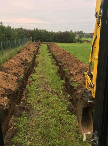 Geoterminis sildymas, horizintalus kasimas, 200metru transejos ir po to klojamas vamzdis