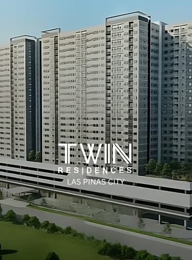 a group of tall buildings with a few trees in the background