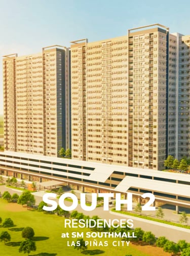 a large apartment complex with a train coming down the tracks