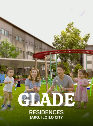 a family of four children playing with a kite