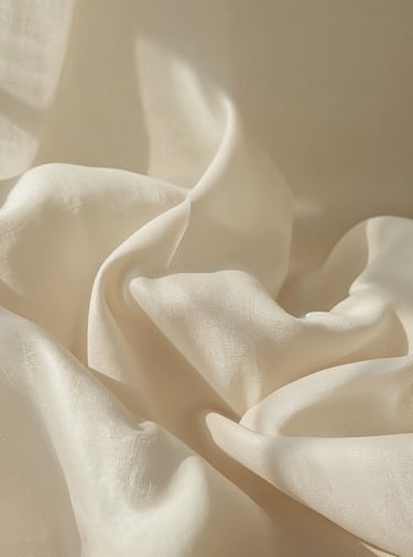 soft linen fabric with flowing texture in warm natural light