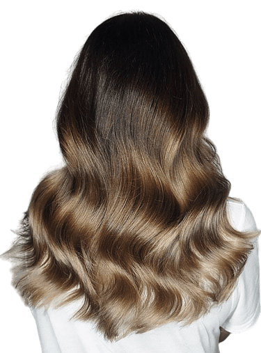 Woman with balayage blonde highlights and smooth styled hair.