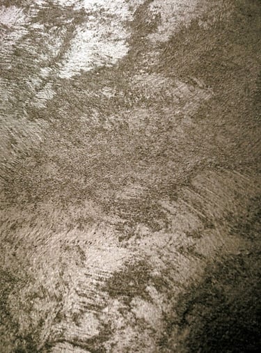 A warm silver paint sample showing its lustre and beautiful grainy texture.