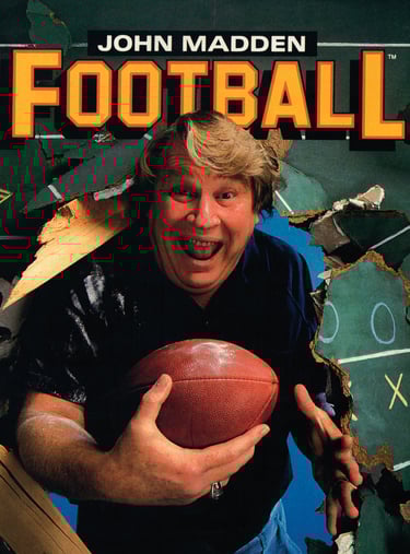 John Madden bursting through the cover of his first game