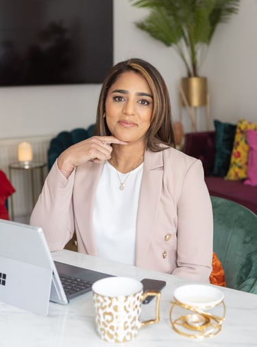 A photo of Anita sitting sat a desk