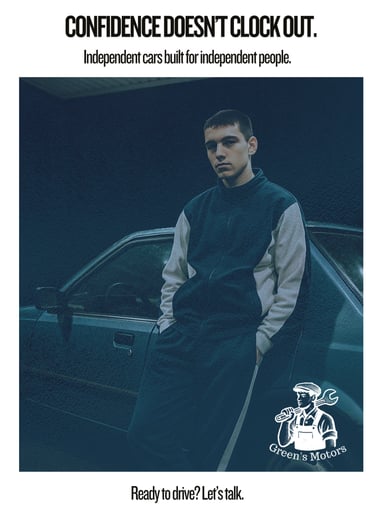 A young man in a tracksuit stands against a blue sedan under harsh petrol station lighting at night.