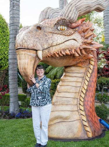 Brenda Posey with dragon sculpture inspired by Ciruelo's art at the Taglyan Complex, Hollywood, CA