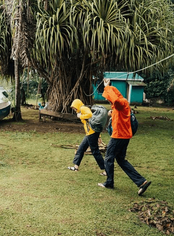 a man and a woman are flying a kite