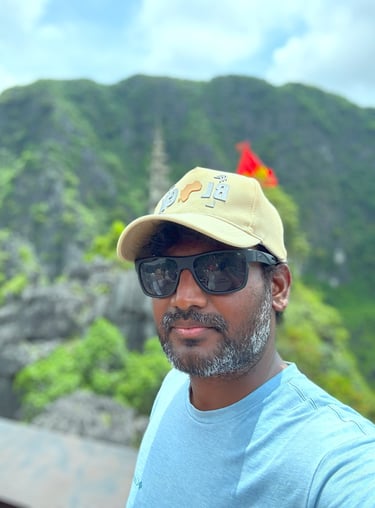 a man in a blue shirt and sunglasses