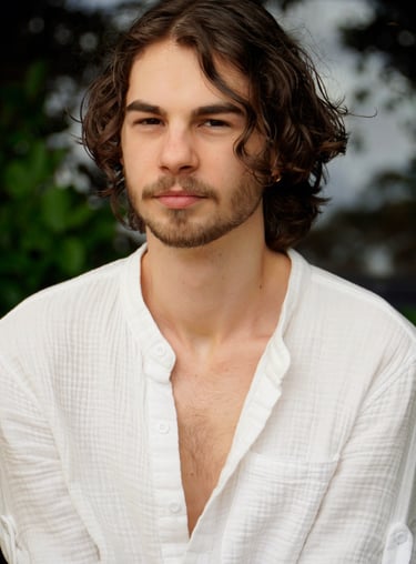 a man with a beard and a white shirt