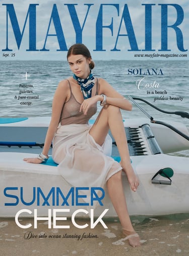Mayfair Magazine September 2025 cover featuring a model in transparent swimwear seated on a mini catamaran.