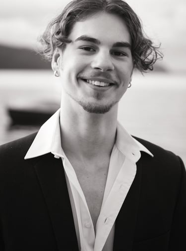 a man in a suit and white shirt