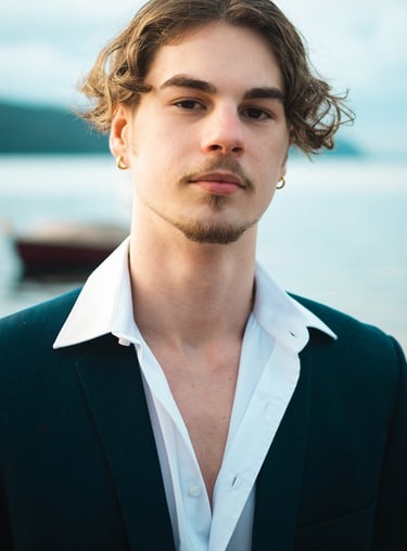 a man in a suit and white shirt