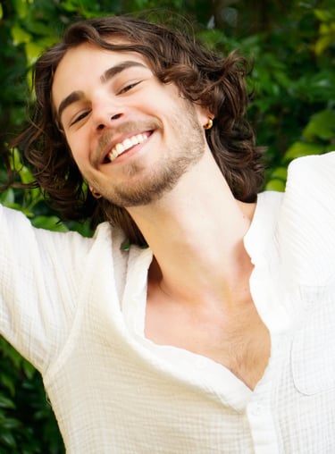 a man with a beard and a white shirt