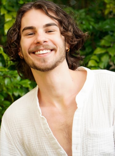 a man with a beard and a white shirt