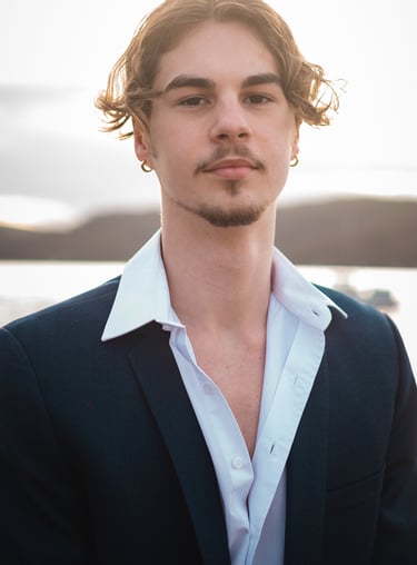 a man in a suit and white shirt