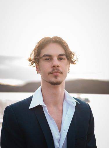 a man in a suit and white shirt