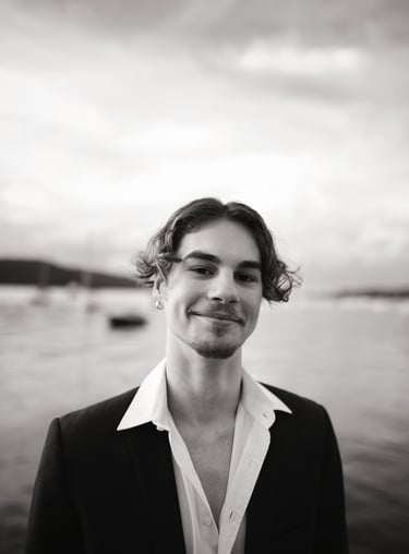 a man in a suit and white shirt