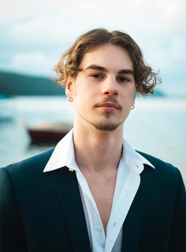 a man in a suit and white shirt