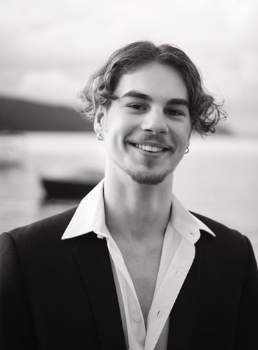 a man in a suit and white shirt