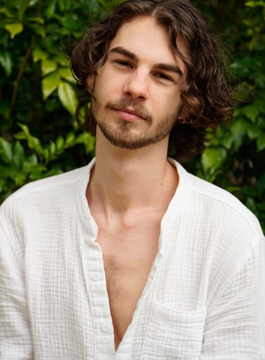 a man with a beard and a white shirt