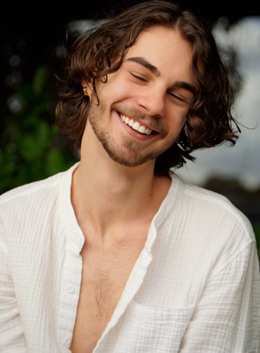 a man with a beard and a white shirt