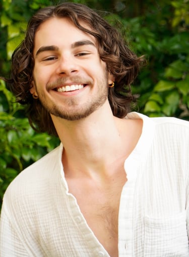 a man with a beard and a white shirt