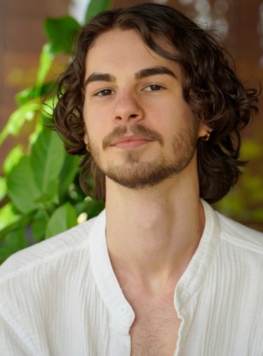 a man with a beard and a white shirt