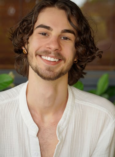 a man with a beard and a white shirt