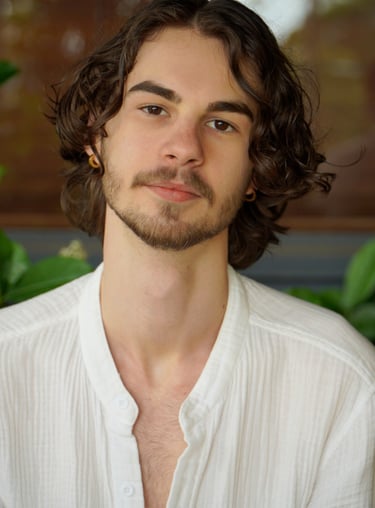 a man with a beard and a white shirt