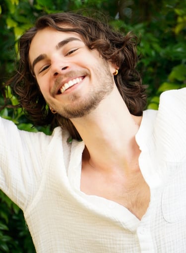 a man with a beard and a white shirt