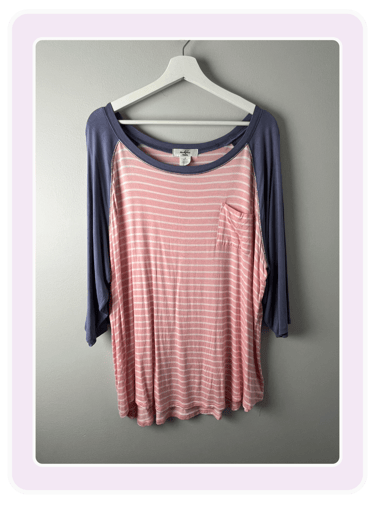 Soft striped pink and white women's baseball tee with blue sleeves, perfect for casual wear and comfort.