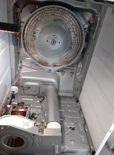 dryer taken a part and showing an exposed heating element