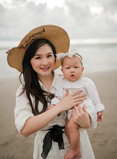 Mother and baby portrait at Seminyak Beach Bali captured in natural and timeless family photography style.