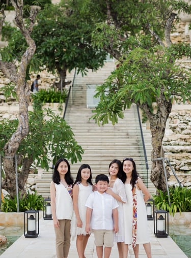 Family walking together during a luxury family photography session at Kempinski Bali resort