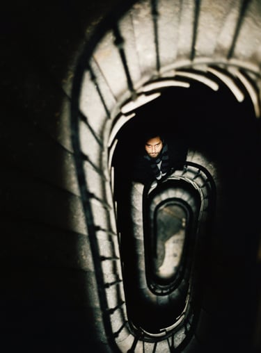 Dorian Chamoin is standing in a spiral staircase way
