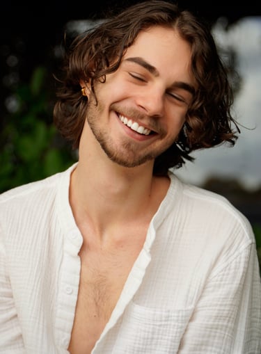 a man with a beard and a white shirt