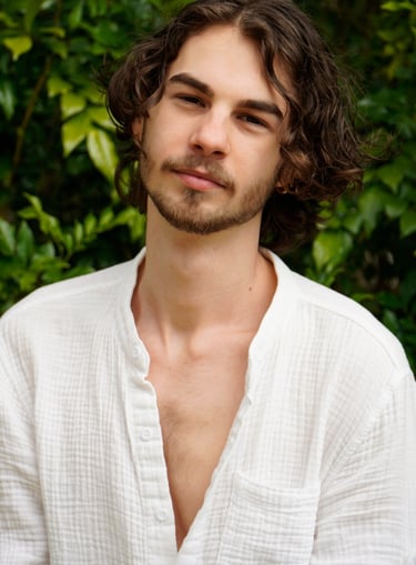 a man with a beard and a white shirt