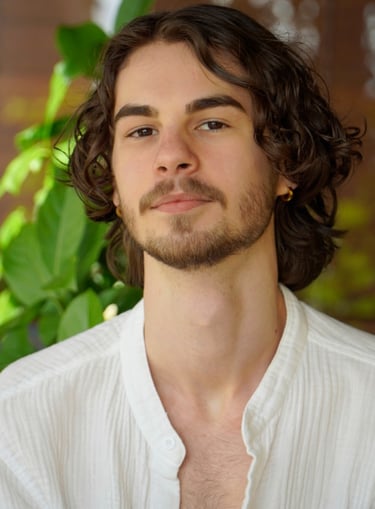 a man with a beard and a white shirt
