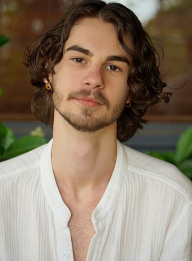 a man with a beard and a white shirt